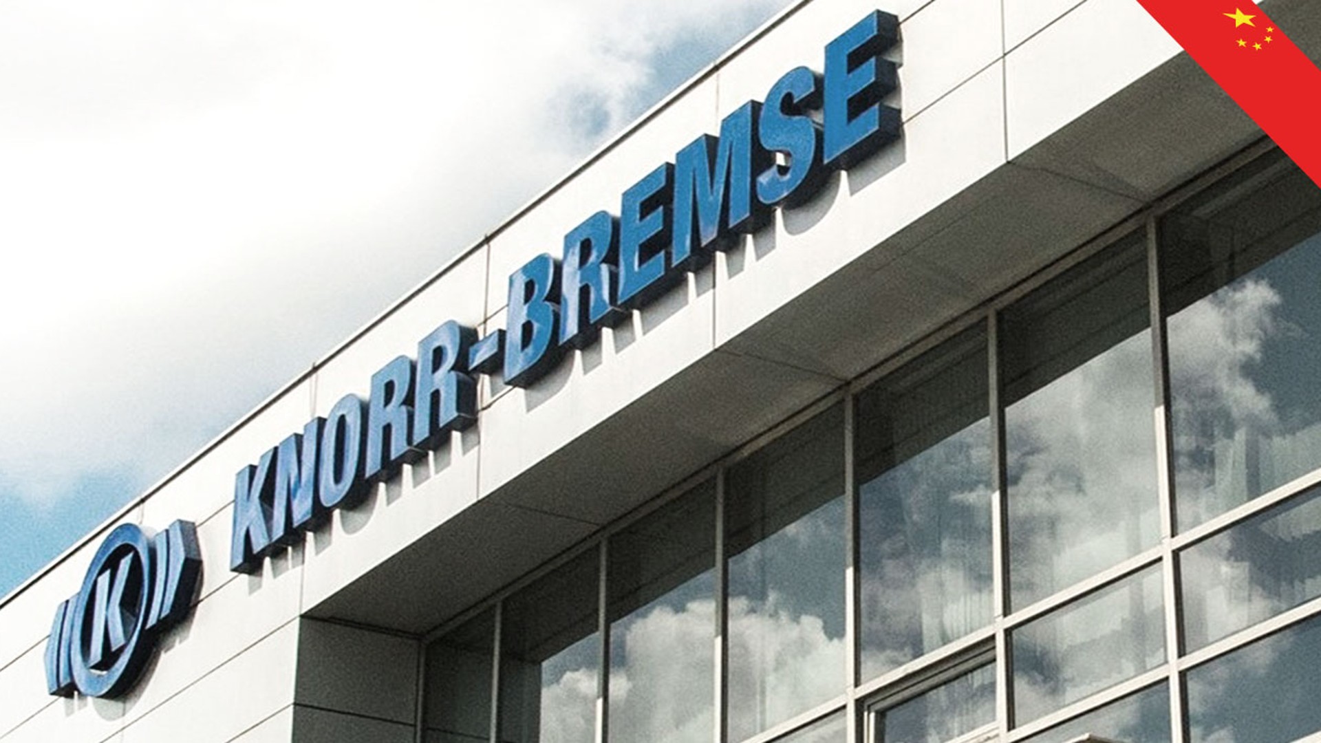 Knorr-Bremse building sign against blue sky.