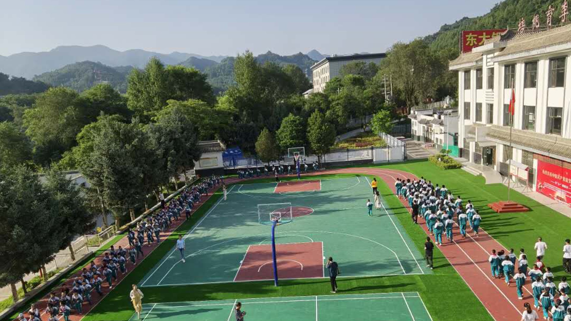 School students exercising on a basketball court.