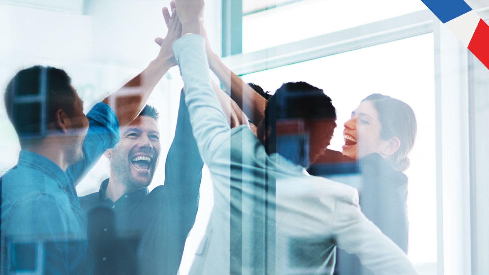 Team celebrating success with high-fives and smiles.