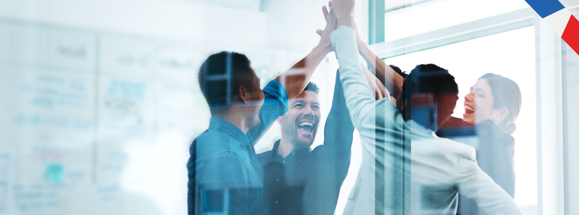 Team celebrating success with high-fives and smiles.