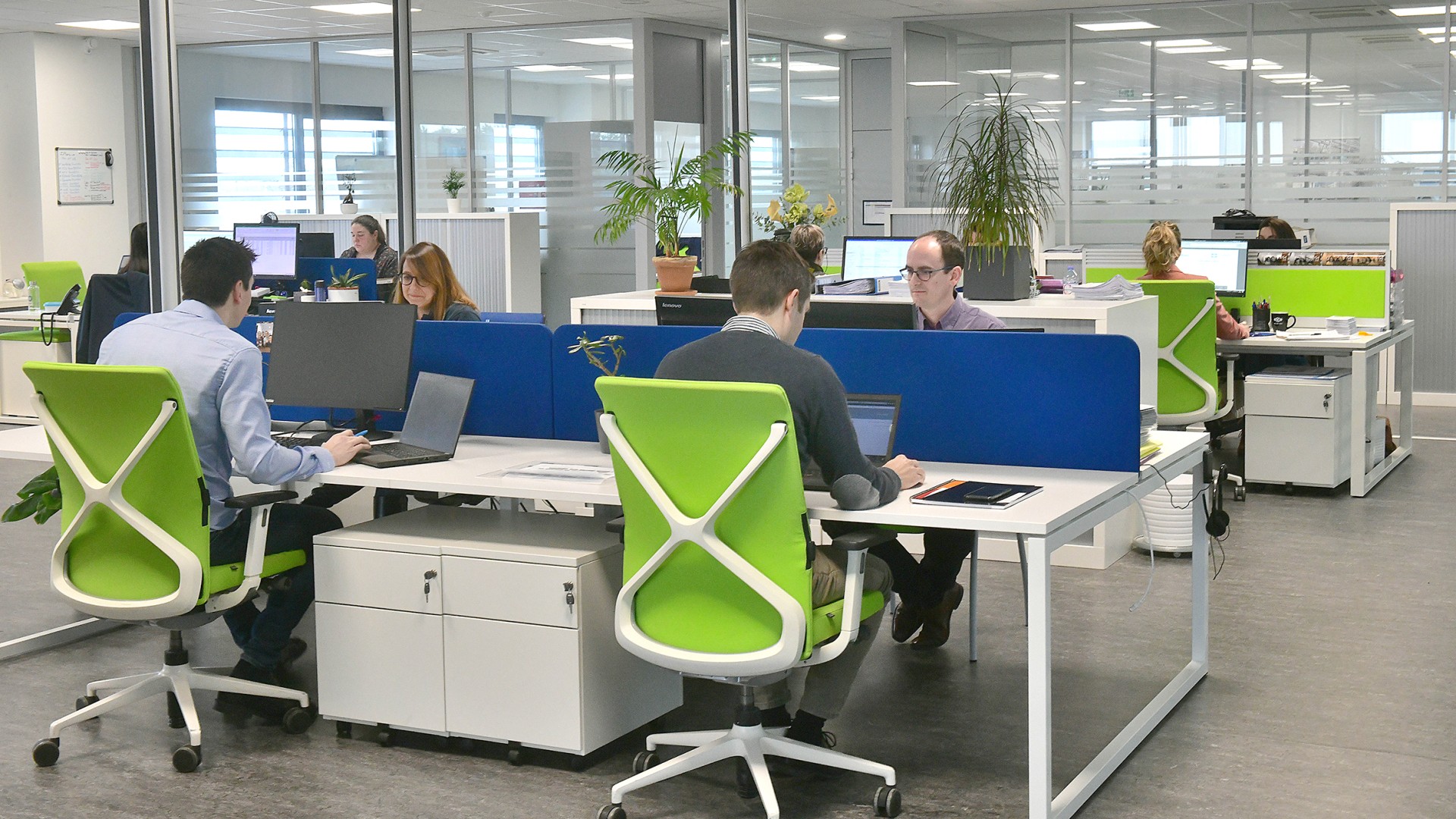 Modern office workspace with employees working