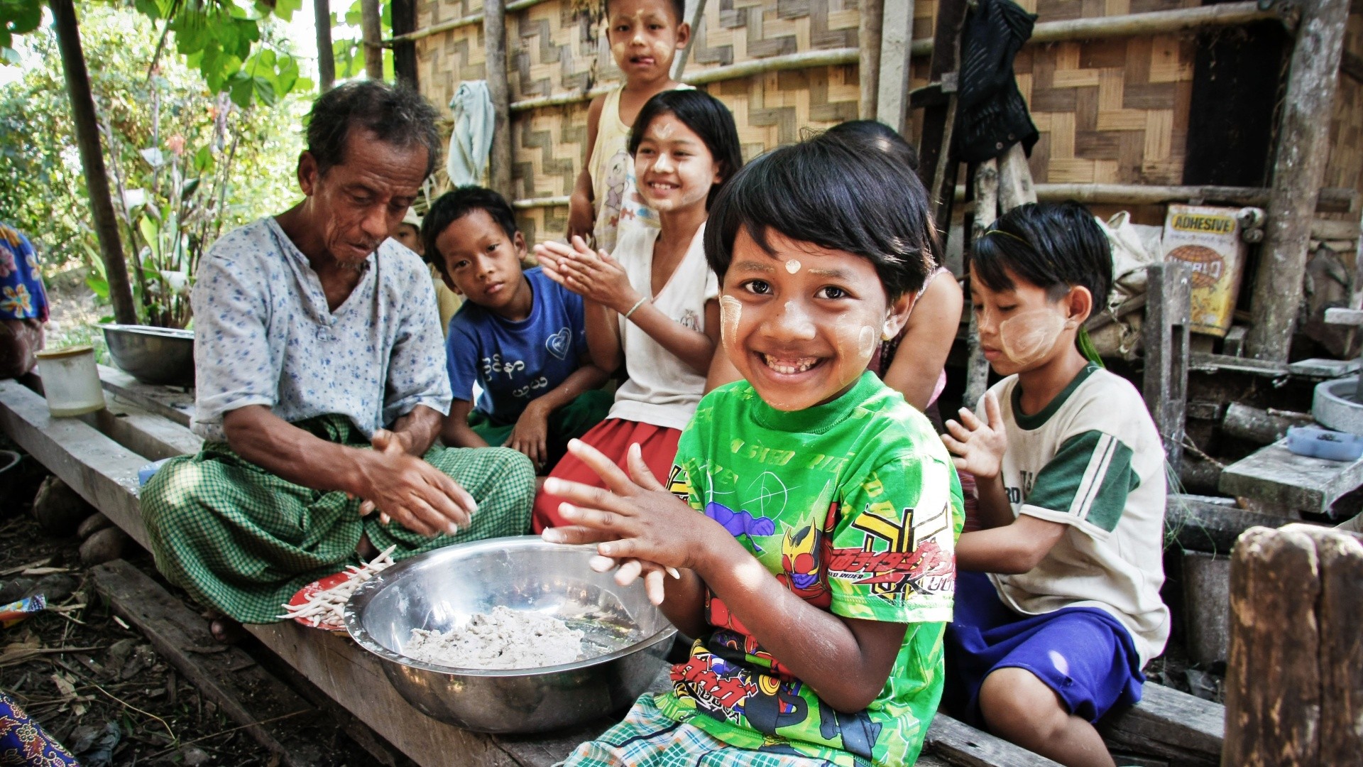 Children smiling and playing in a rural