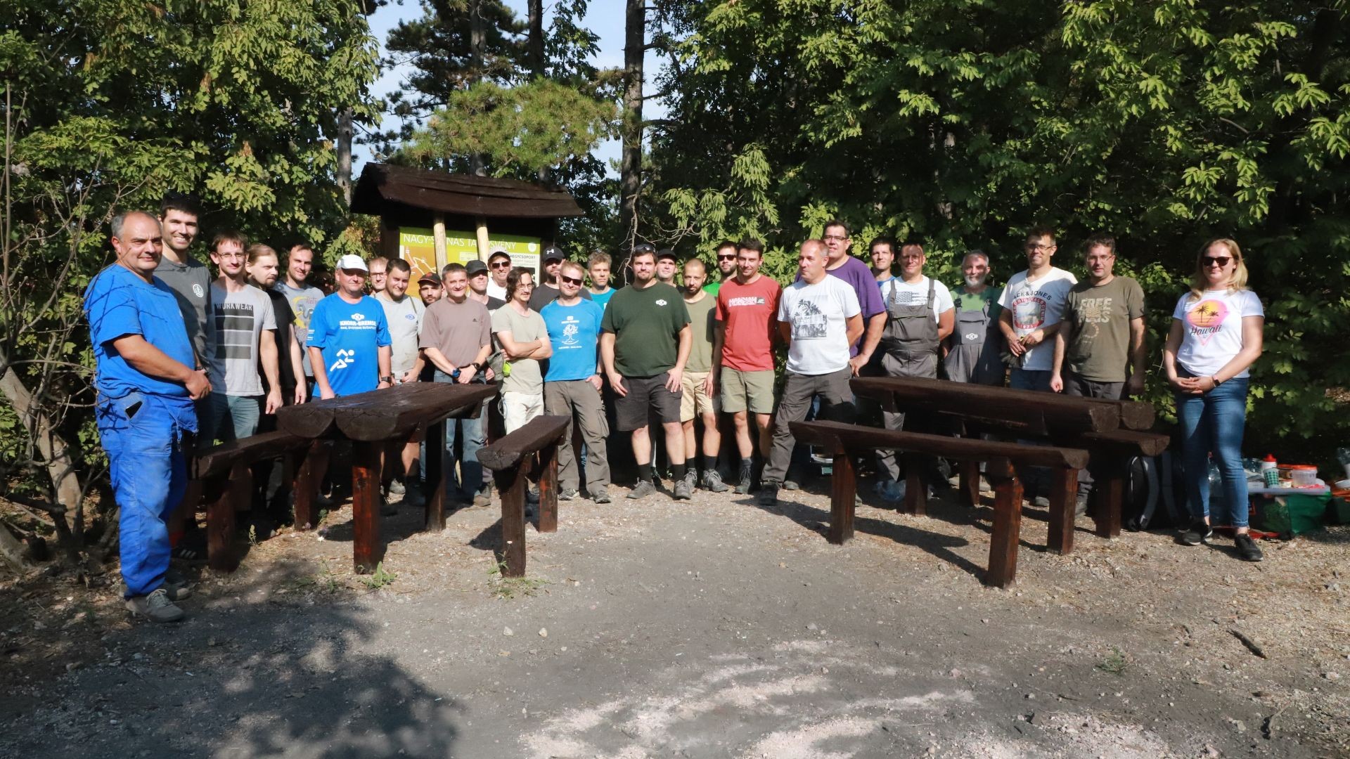 Group photo of employees in outdoor setting.