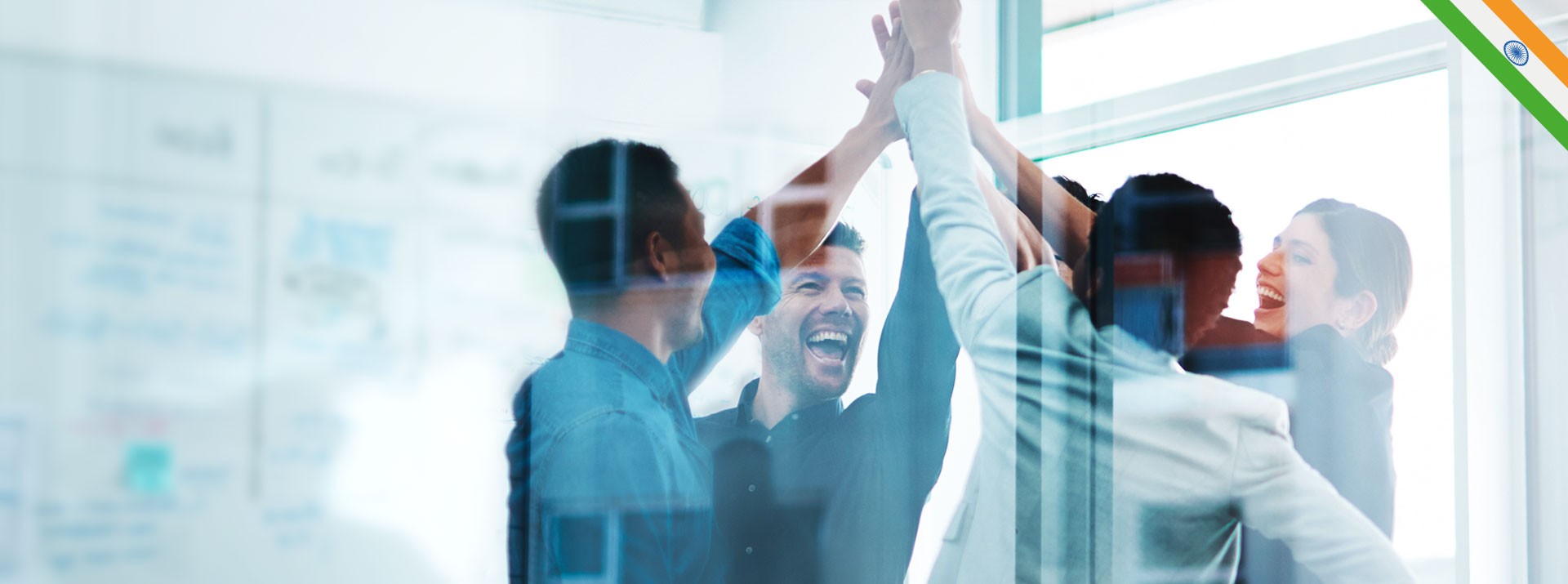 Team celebrating success with high-fives.