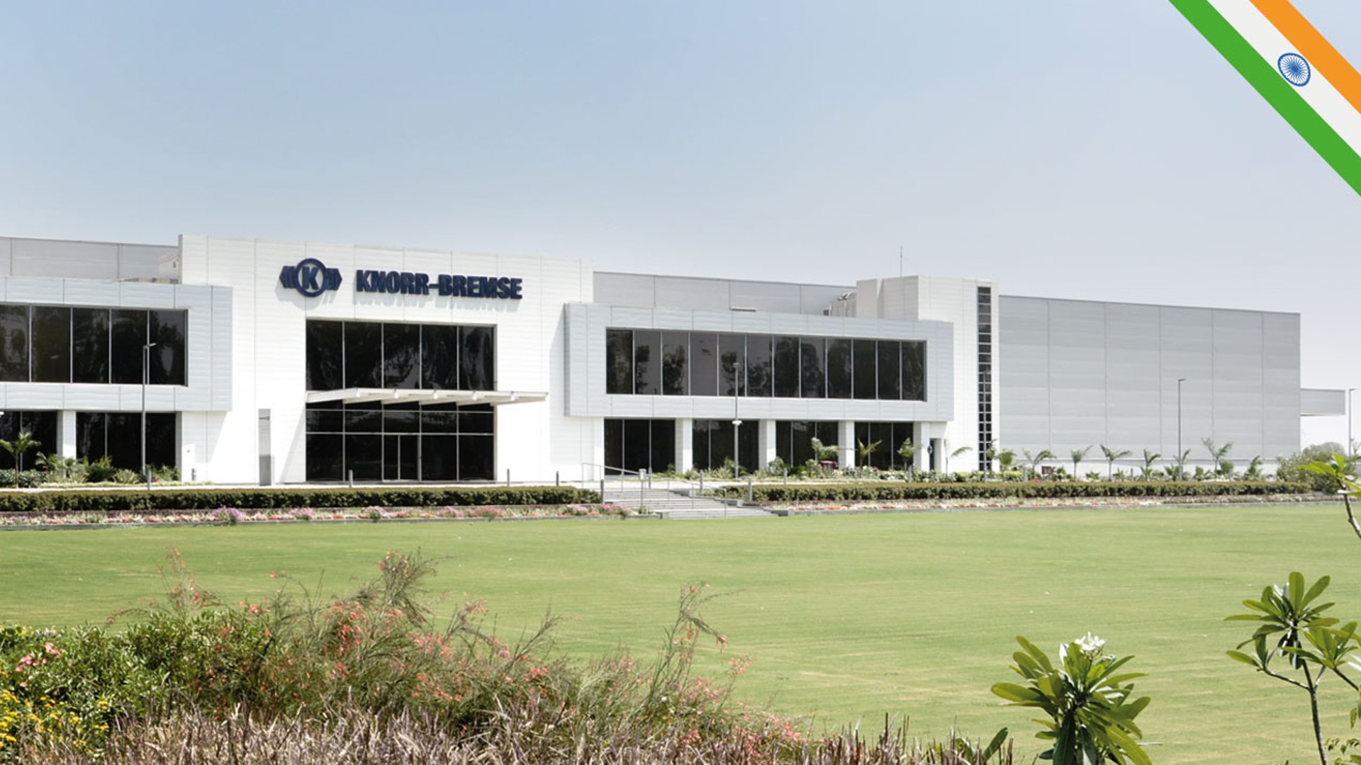 Knorr-Bremse corporate building with landscaped surroundings.
