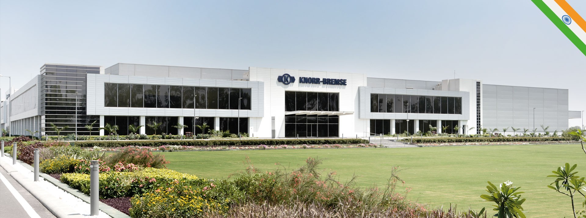 Knorr-Bremse corporate building with landscaped surroundings.