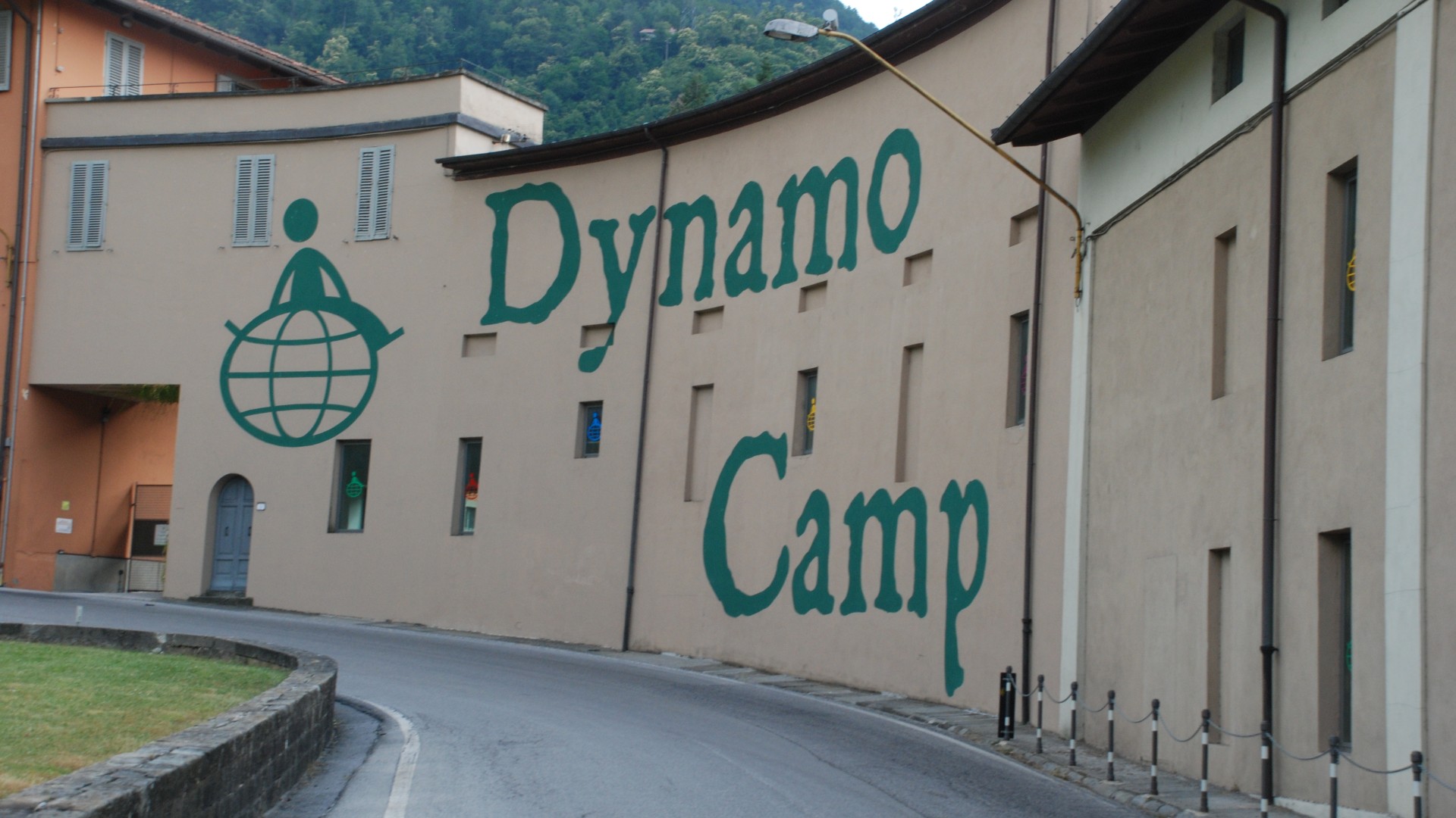 Dynamo Camp wall mural along curved street
