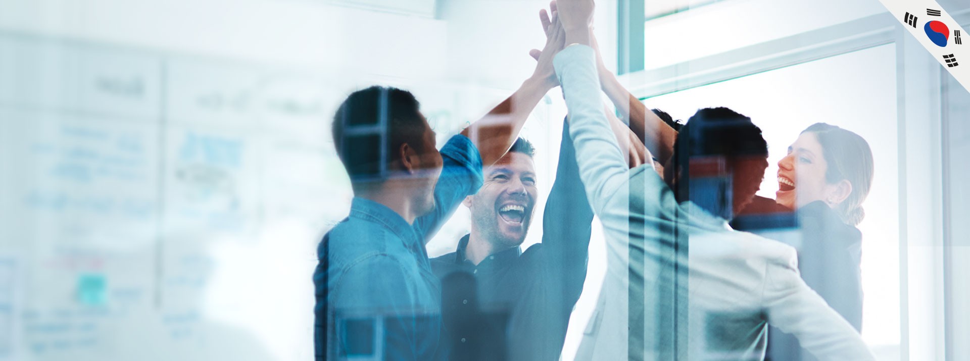 Team celebrating success with high-fives and smiles.