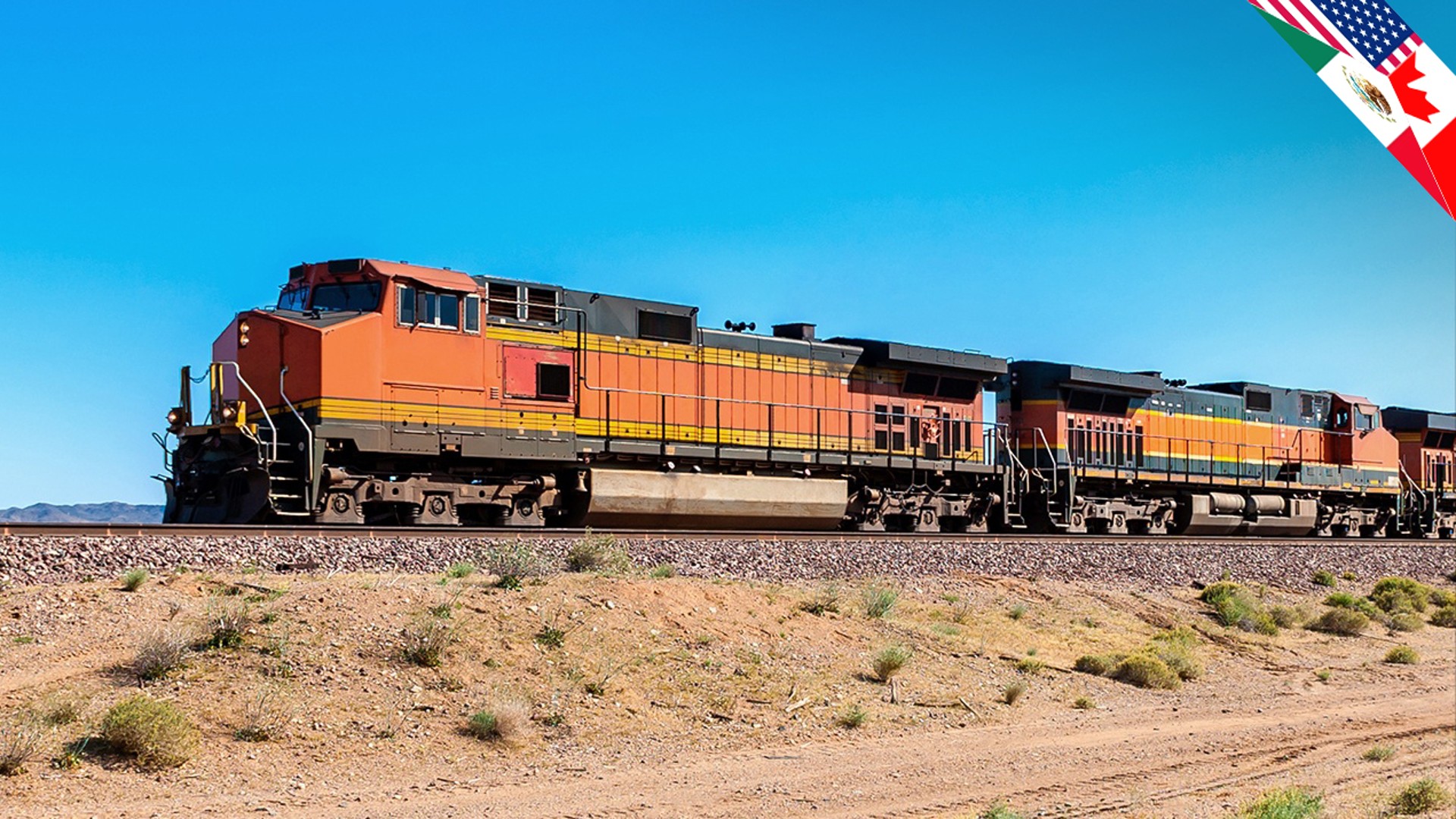 Freight trains passing through arid landscape under
