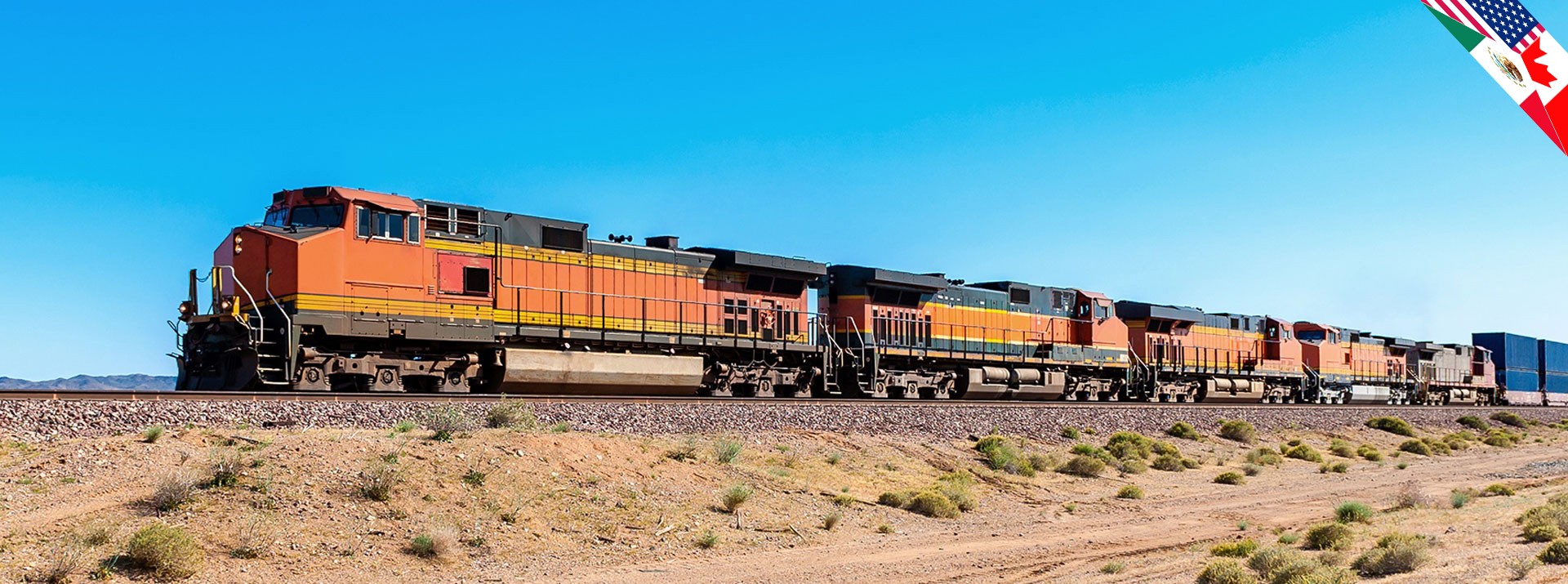 Freight trains traveling on open railway tracks.