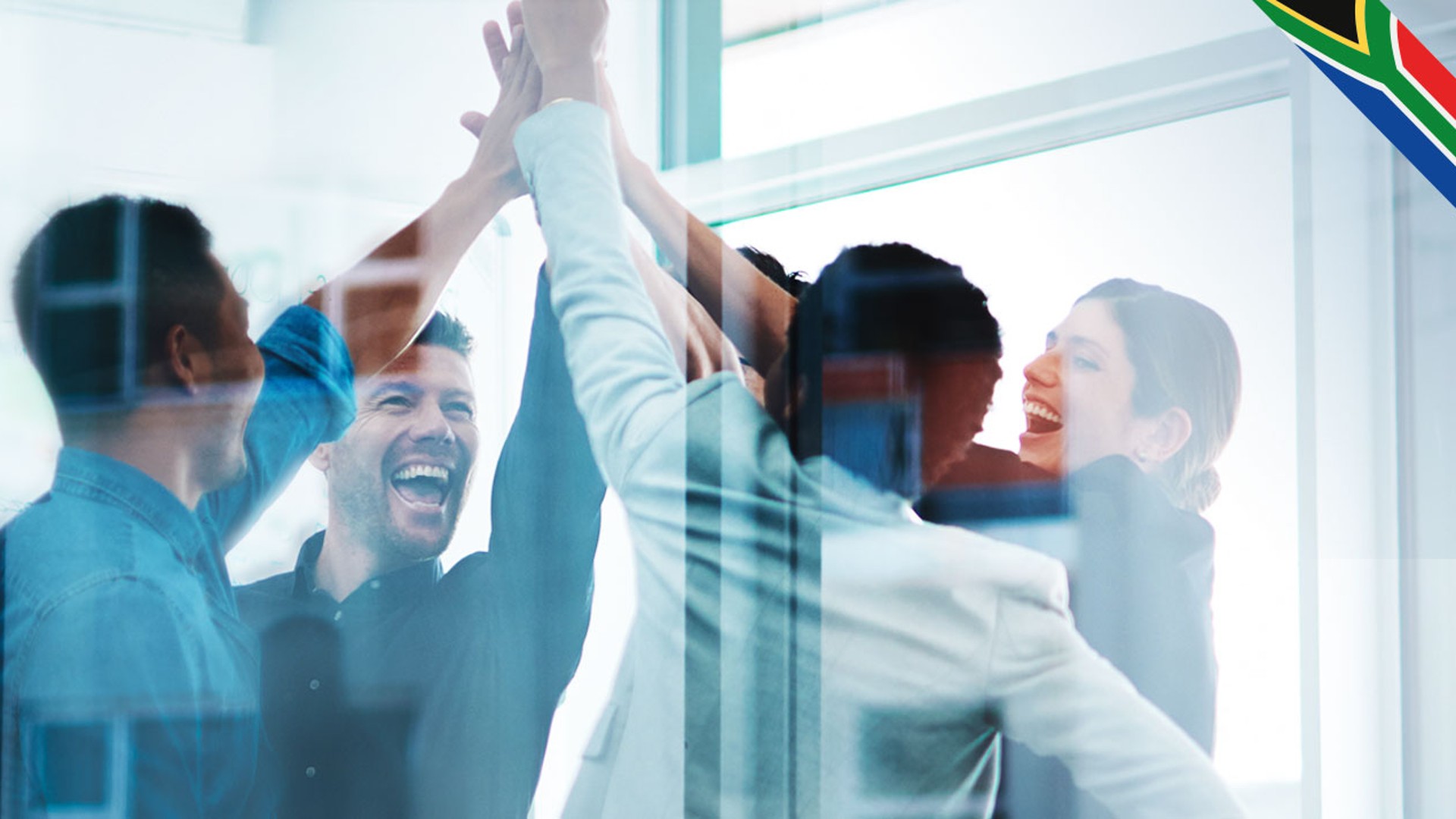 Team celebrating success with high-fives and smiles.