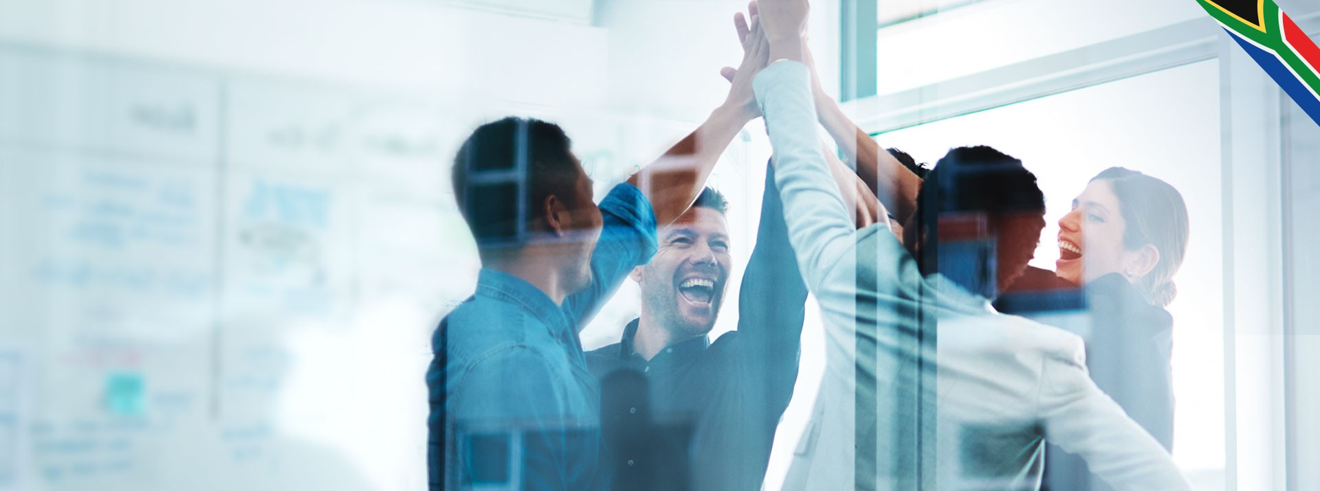 Team celebrating success with high-fives and smiles.