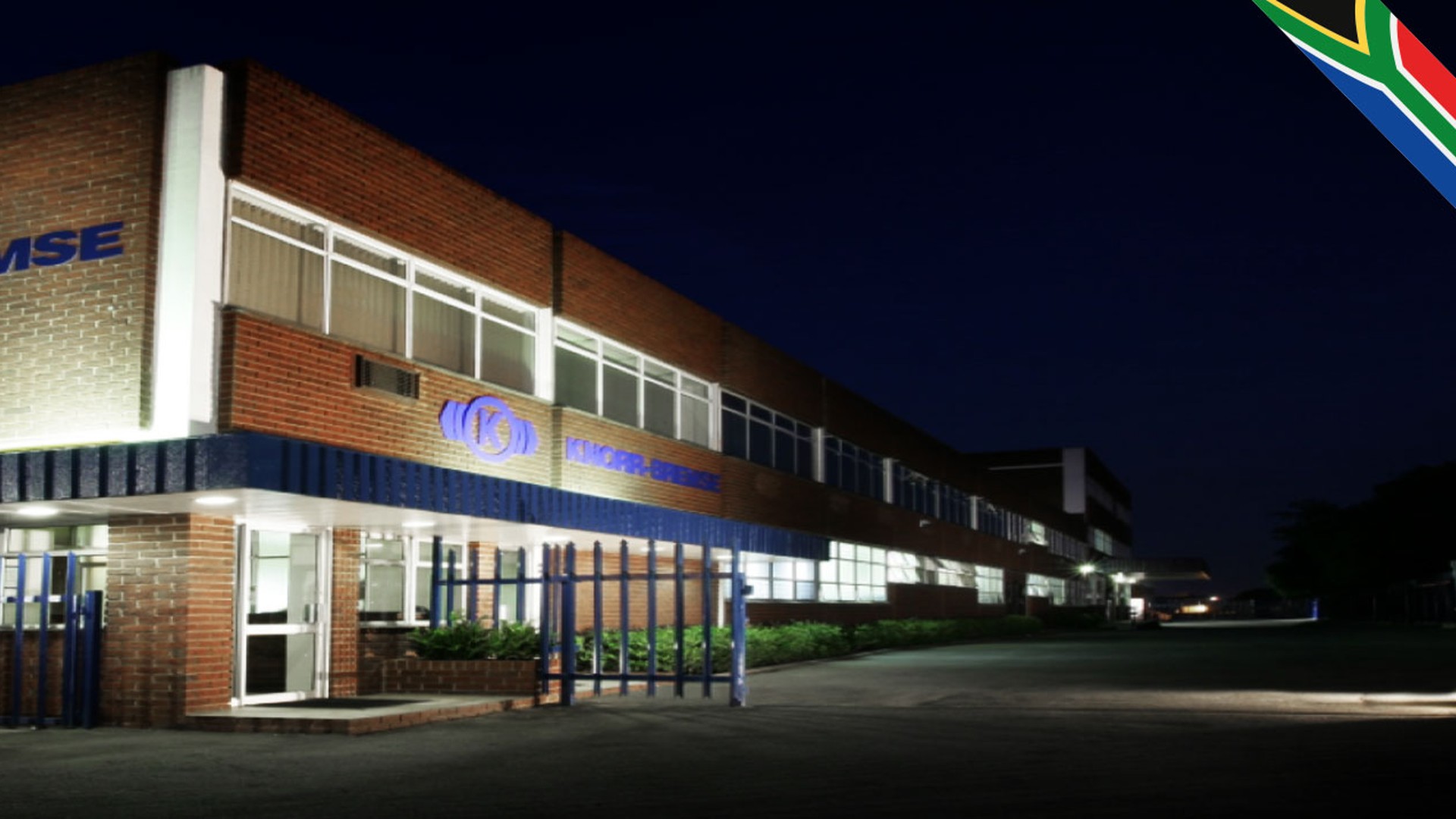 Knorr-Bremse building illuminated at night.