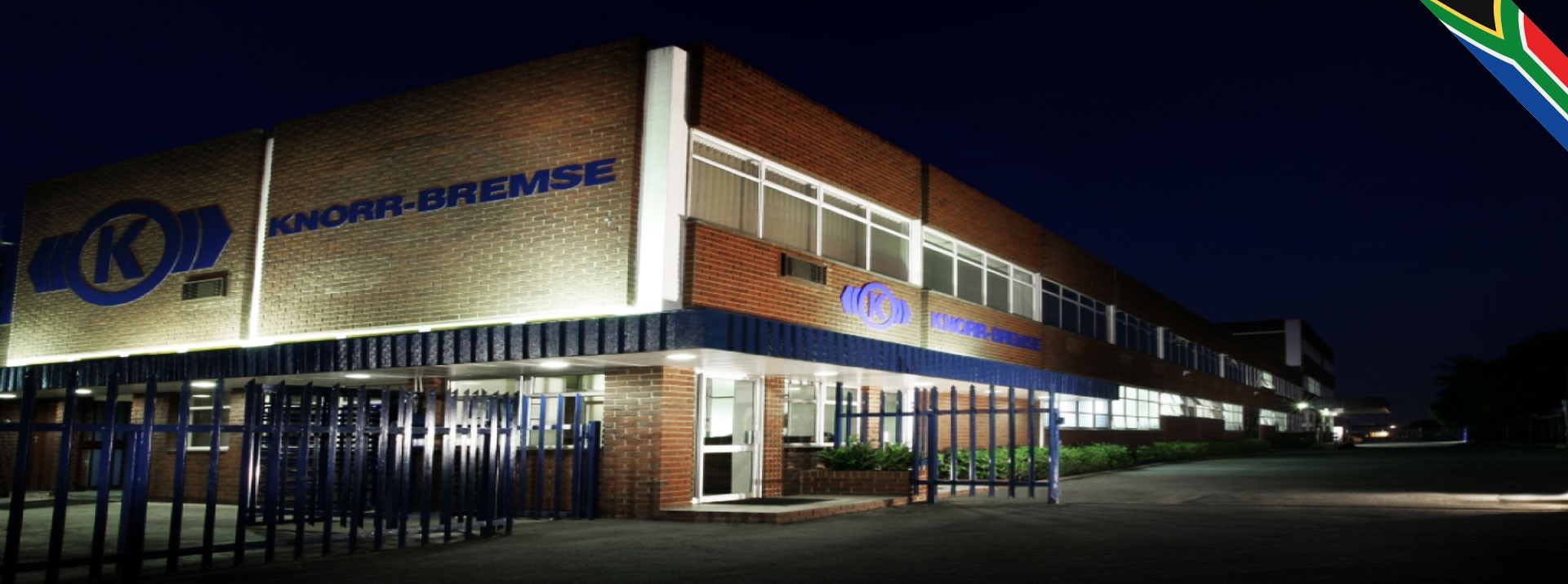 Knorr-Bremse building illuminated at night.