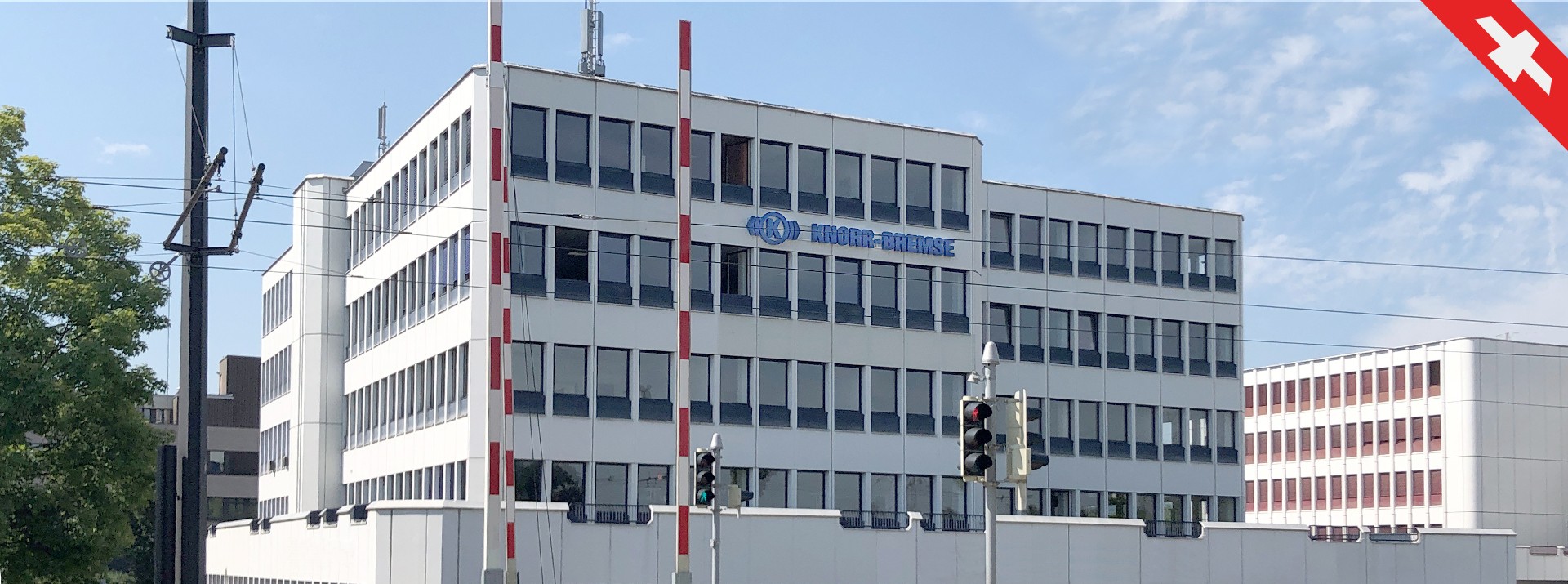 Knorr-Bremse building with clear blue sky.