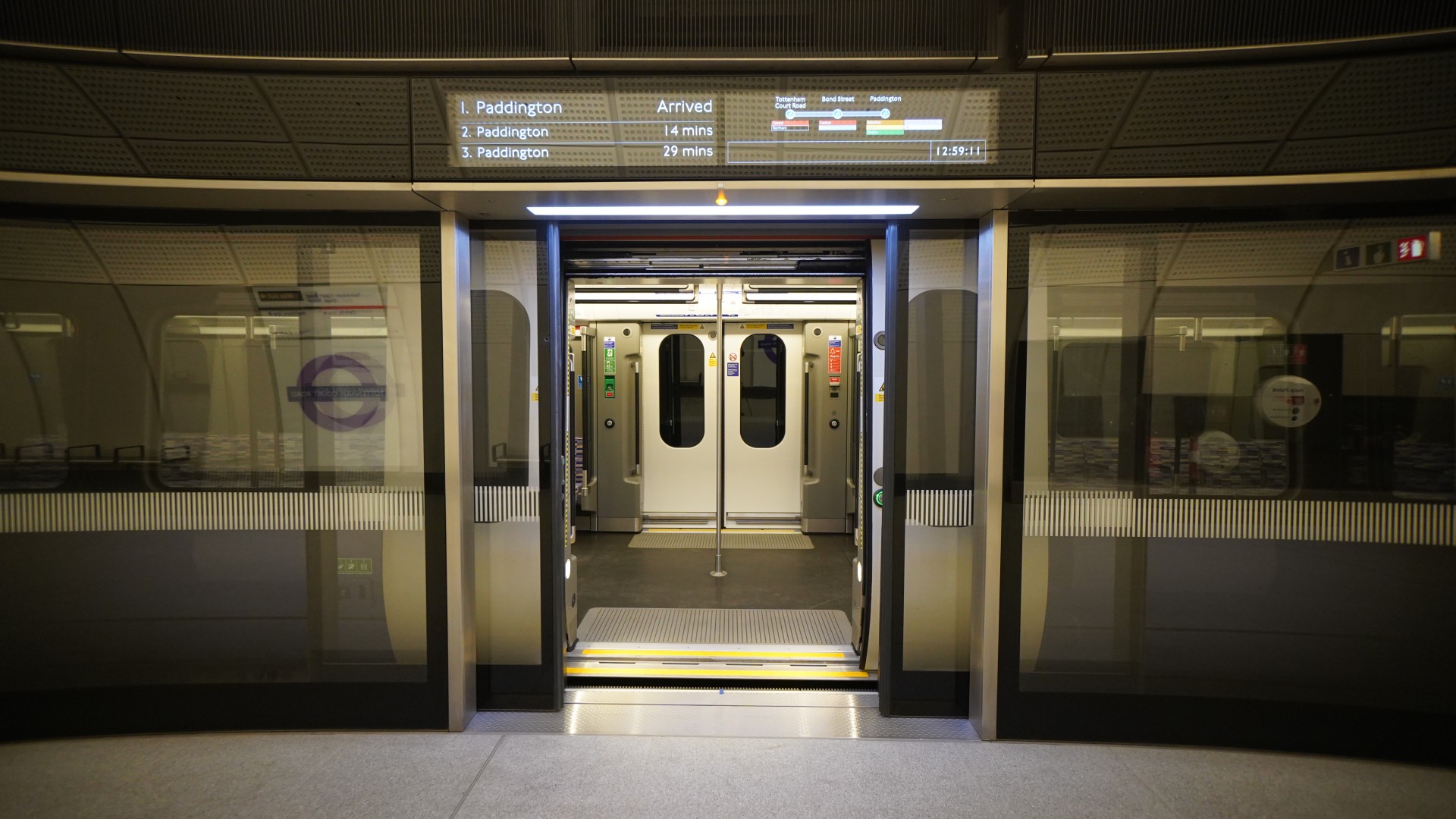 Opened subway doors at Paddington station entrance.