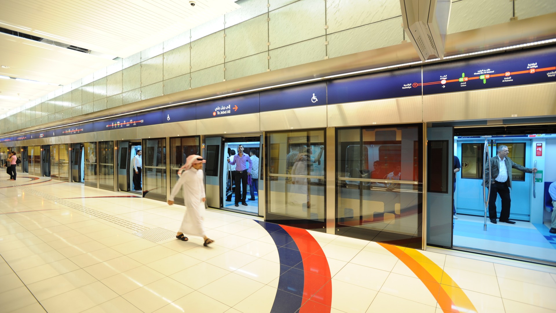 Metro station with commuters entering and exiting