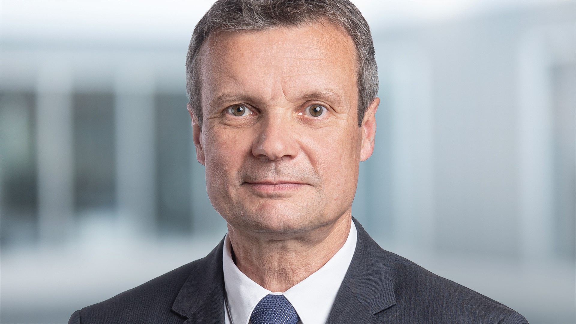 Businessman in suit against blurred background