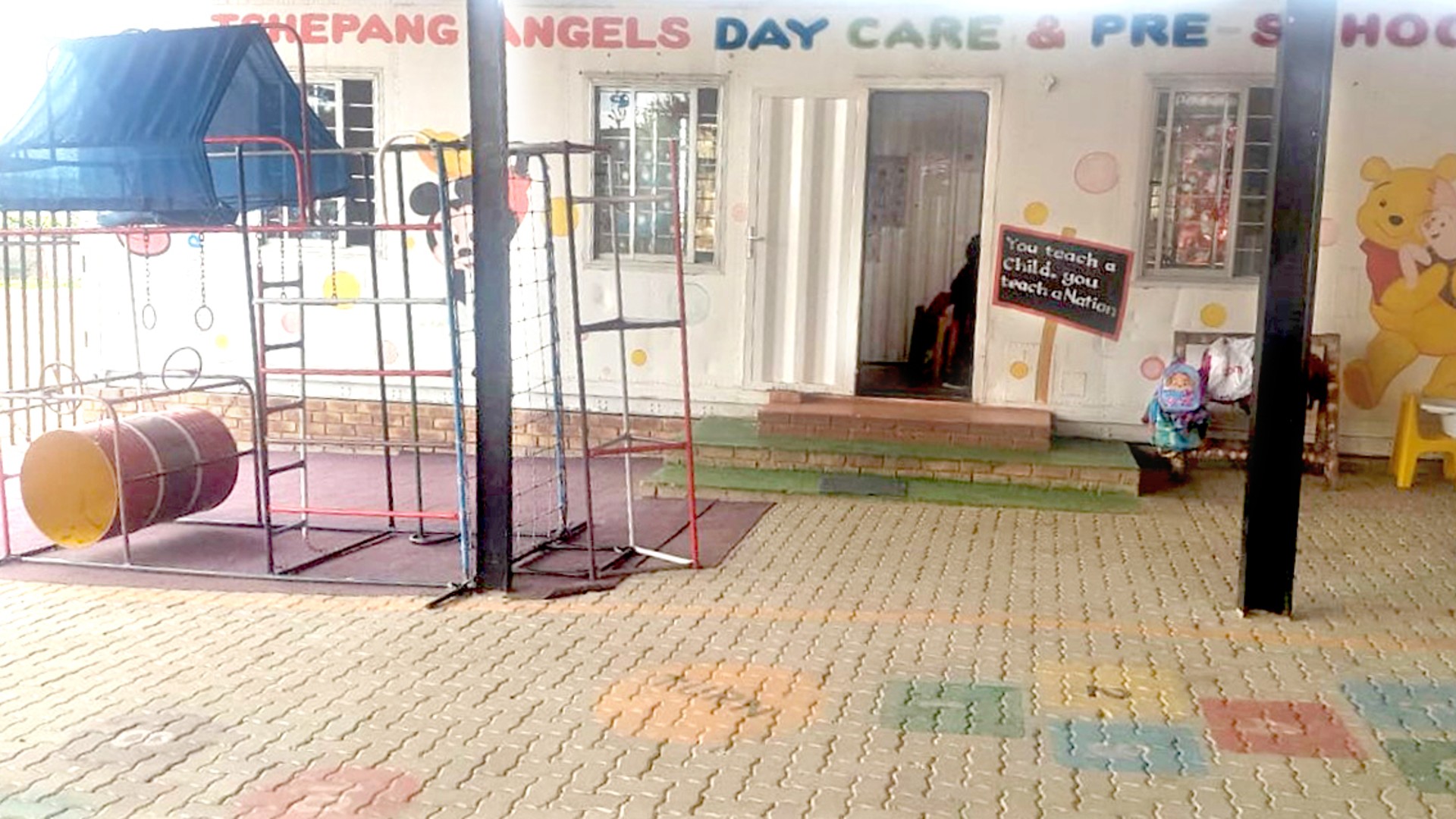 Playground and entrance of a daycare center.