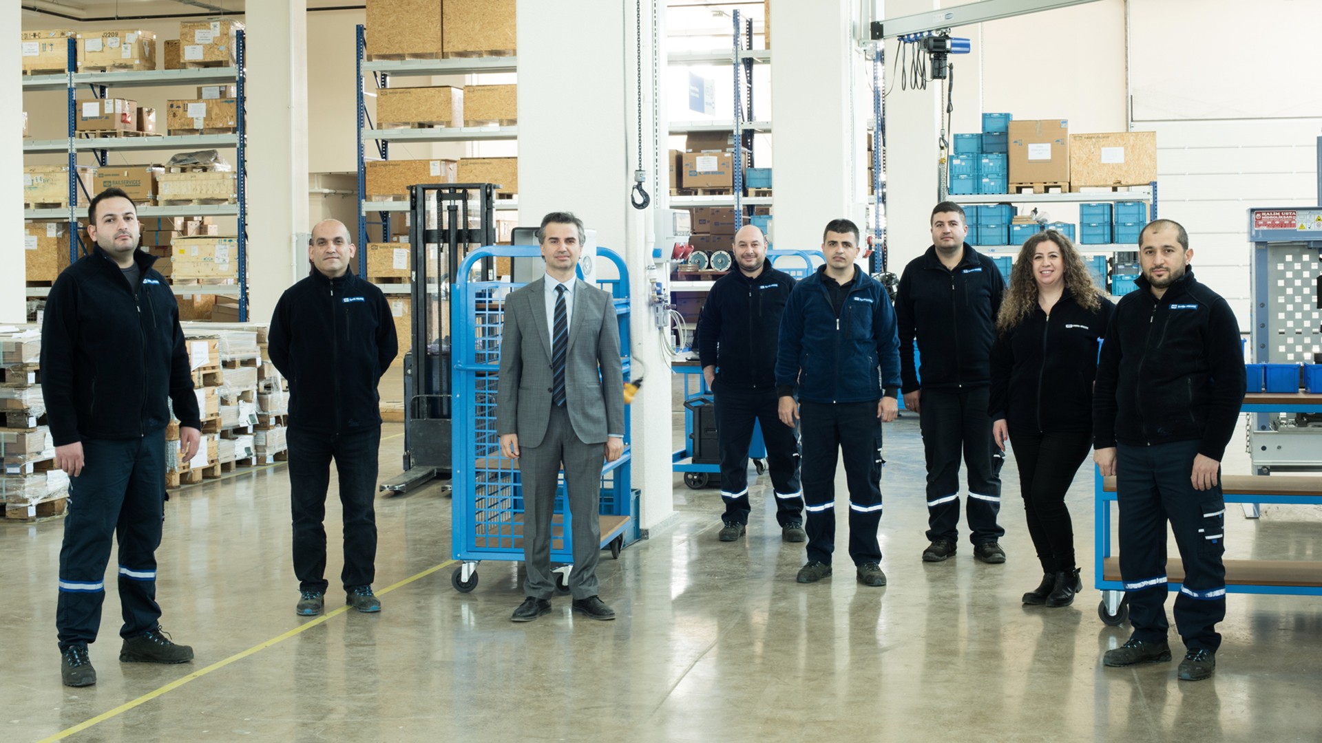 Knorr-Bremse team in warehouse setting with equipment