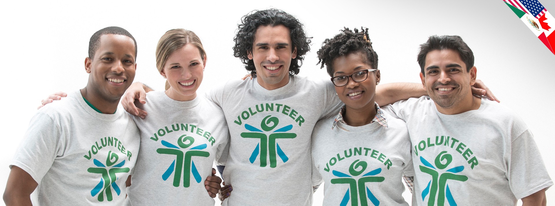 Diverse group of volunteers smiling in T-shirts.