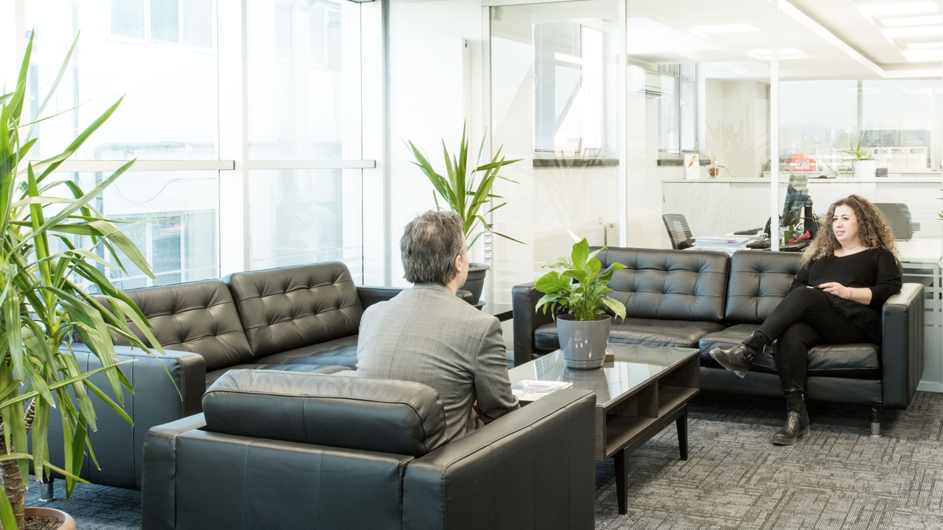 Business meeting in modern office lounge